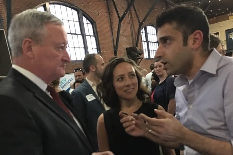 SocialLadder CEO Raavi Iqbal (right) speaks with Philadelphia Mayor Jim Kenney