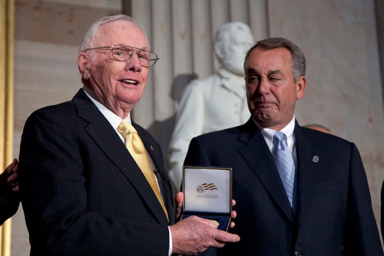 FILE - In this Nov. 16, 2011 file photo, House Speaker John Boehner of Ohio, right, presents a Congressional Gold Medal to Neil Armstrong during a ceremony to honor astronauts on Capitol Hill in Washington. Court documents show that an Ohio hospital paid the estate of astronaut Armstrong $6 million to settle allegations that post-surgical complications led to his 2012 death. The 2014 settlement went to 10 family members, including Armstrong's two sons, sister, brother and six grandchildren, according to documents filed with the Hamilton County Probate Court in Cincinnati which were publicly available on Tuesday, July 23, 2019. (AP Photo/Evan Vucci, File)