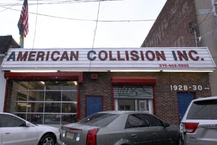 South Philly's American Collision, which works on police cars, is owned by an ex-con, sentenced to three years for turning another shop he owned into what prosecutors called a "shop of fraud." He's also under investigation for insurance fraud. (Yong Kim/Staff Photographer)