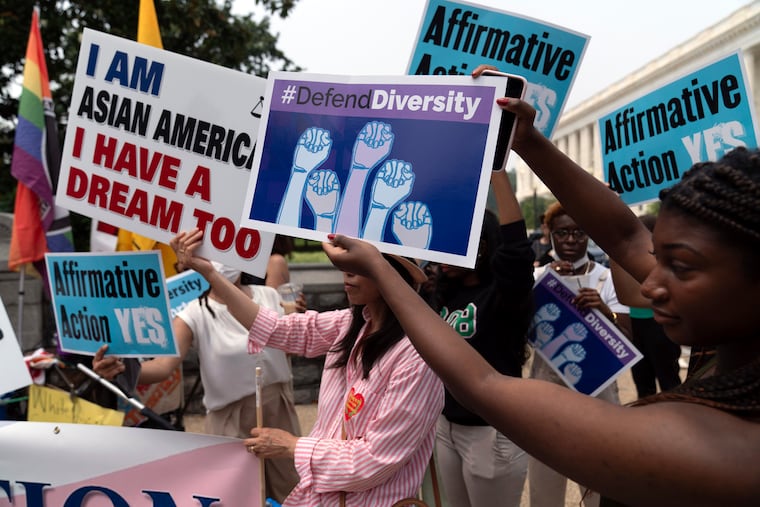 Demonstrators protest outside of the U.S. Supreme Court in Washington on Thursday after the court's conservative majority struck down affirmative action in college admissions, saying race cannot be a factor.