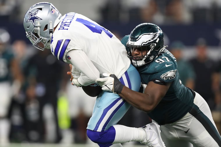 Eagles nose tackle Javon Hargrave stops Dallas Cowboys quarterback Dak Prescott during the third quarter on Monday, September 27, 2021 in Arlington, Texas.