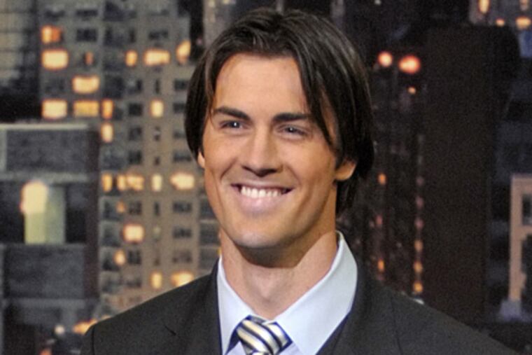 Phillies pitcher Cole Hamels presents the "Top Ten Things That Went Through Cole Hamels' Mind After Winning The World Series," on the set of the Late Show with David Letterman last night. (AP Photo / CBS, Jeffrey R. Staab)