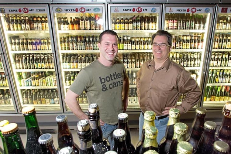 Brad Helder (left) and Mike Kellett at their new Bottle Bar East. One entrepreneur says the area is “going back to its roots, when Frankford Avenue was ‘the’ avenue for shopping.” (David M Warren / Staff Photographer)