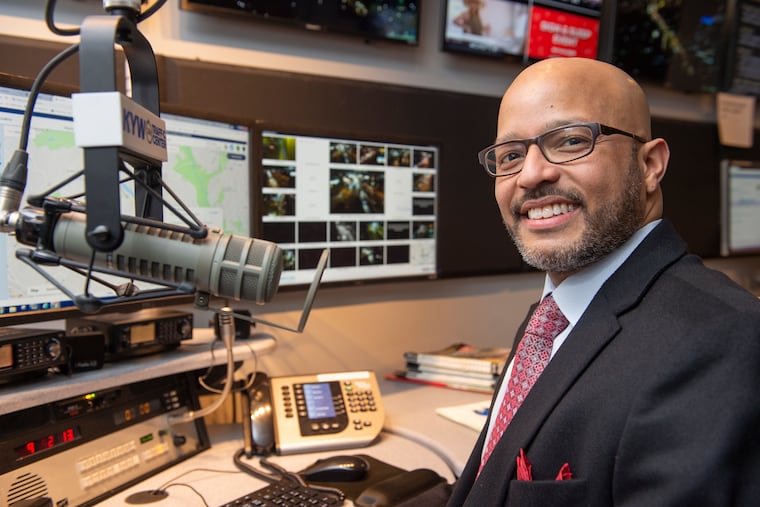 Malcolm Poindexter III, son of the late newscaster, Malcolm Poindexter Jr., does traffic reports overnight for KYW Radio at the station's studios in the Spring Garden section of Philadelphia. (Jonathan Wilson / For the Daily News)