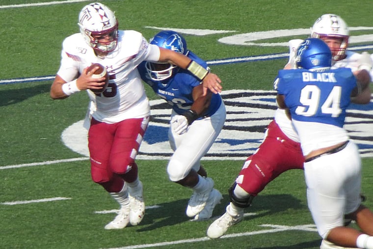 Temple's Anthony Russo can't escape Buffalo DE Ledarius Mack, who would cause a fumble on this play that was recovered by the Bulls Eric Black.