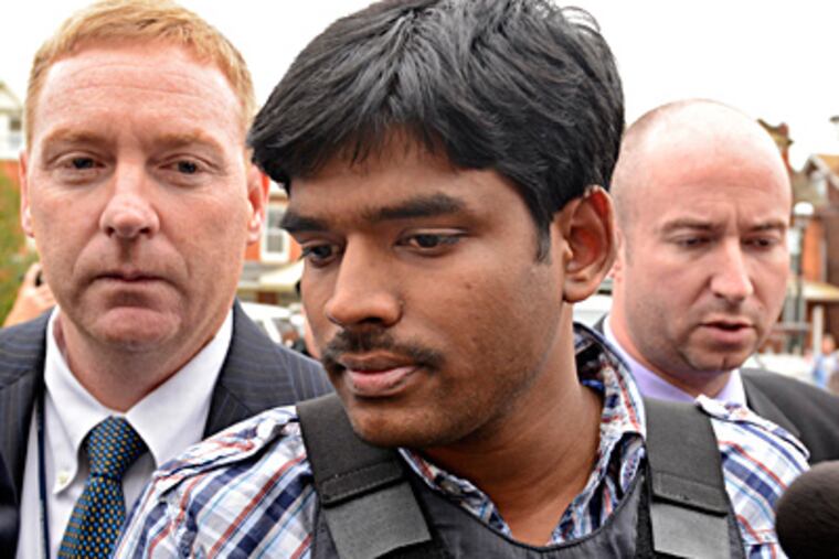 In body armor, Raghunandan Yandamuri is taken into an arraignment on murder, kidnapping, and other charges. (Tom Gralish / Staff Photographer)