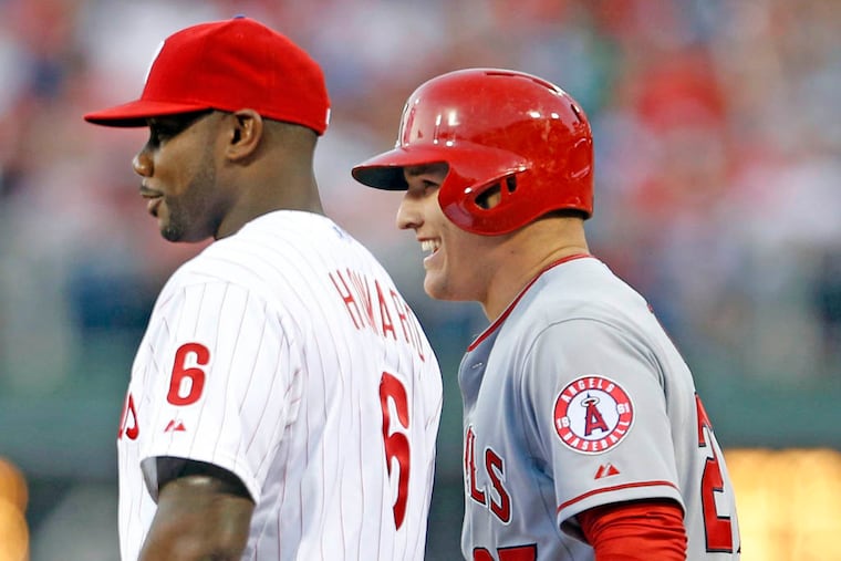 Longtime Phillies fan Mike Trout chats with Ryan Howard after singling in Angels’ 4-3 win.