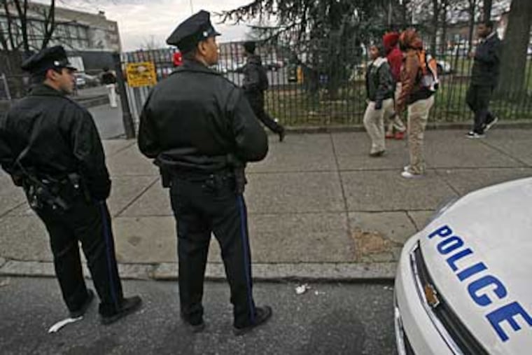 Philadelphia police keep watch at South Philadelphia High School. Increasing violence has led Asian students to boycott the school. (ALEJANDRO A. ALVAREZ / Staff Photographer)