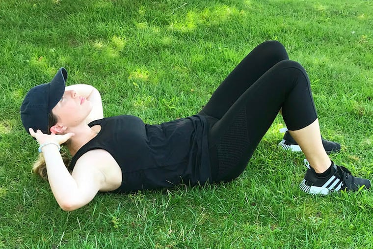 Ashley demonstrates proper crunch form.