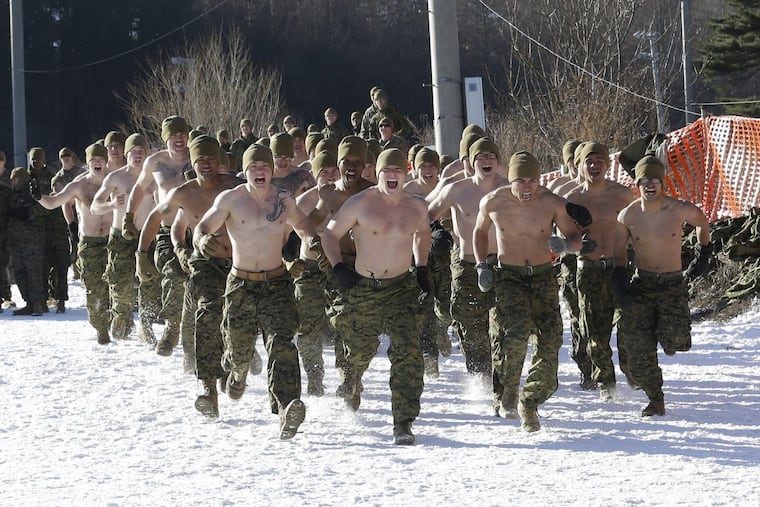 U.S. Marines from III-Marine Expeditionary Force from Okinawa, Japan, run on the snow to attend a joint military winter exercise with South Korean marines in Pyeongchang, South Korea, Tuesday, Dec. 19, 2017. (AP Photo/Ahn Young-joon)