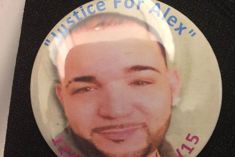 A button worn by Wilfredo Rojas in court reads “Justice for Alex,” his son who was shot in his SUV outside a Feltonville club. (REGINA MEDINA / DAILY NEWS STAFF)