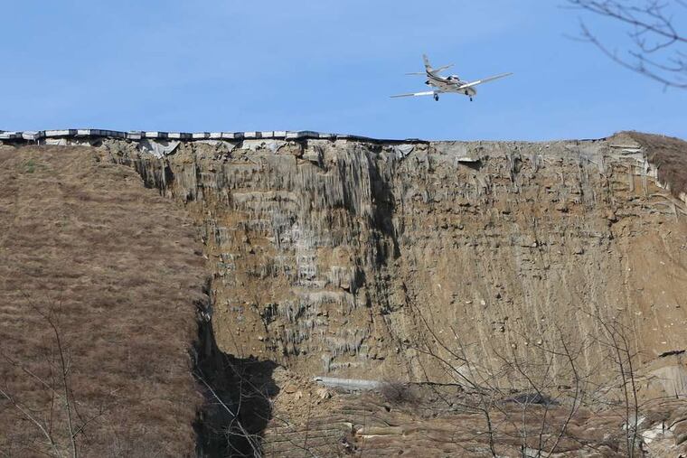 The crumbling end of Yeager Airport in Charleston, W. Va., where a landslide broke loose Thursday, taking out power lines, trees, and a church.