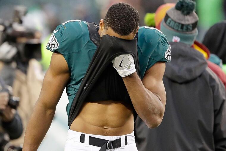 Jordan Matthews wipes his face after losing to the Washington Redskins.