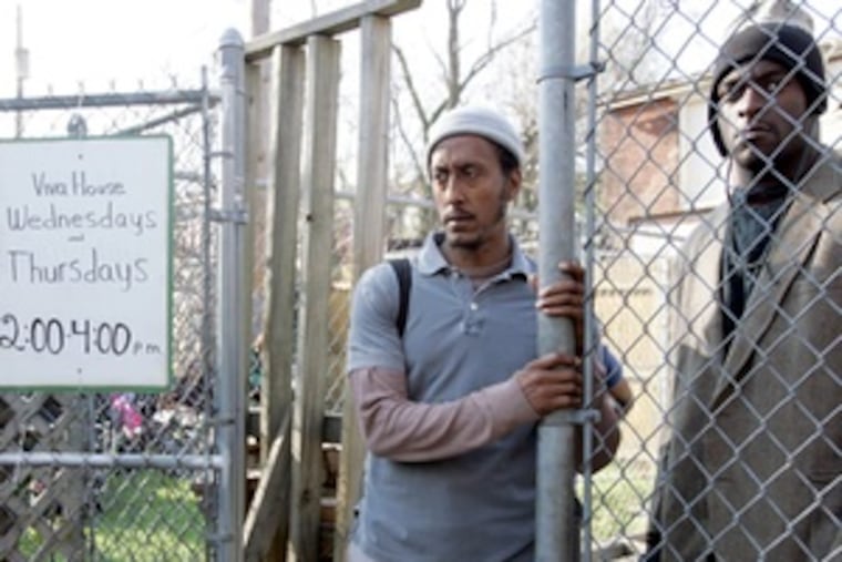 Bubbles, the junkie and informant played with pathos by Andre Royo (left), talks with a connection. The character ended last season in an institution after trying to commit suicide.