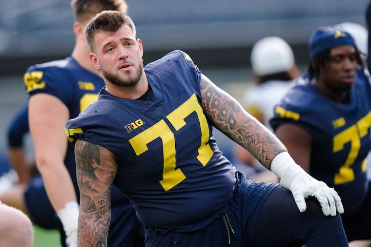 Michigan offensive lineman Trevor Keegan warms up during NCAA college football practice Saturday, Dec. 30, 2023, in Inglewood, Calif. (AP Photo/Ryan Sun)