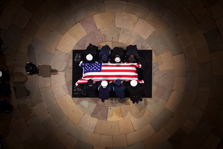 The flag-draped casket of former President Jimmy Carter lies in state at the rotunda of the U.S. Capitol on Tuesday, Jan. 7, 2025.