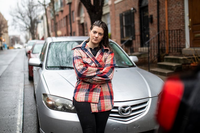 Julia Sheppard, photographed in 2021 after she spent a month looking for her Mazda sedan, which had been "courtesy towed." Then a Temple law student, Sheppard had to pay towing fees because she couldn't document the city's involvement.