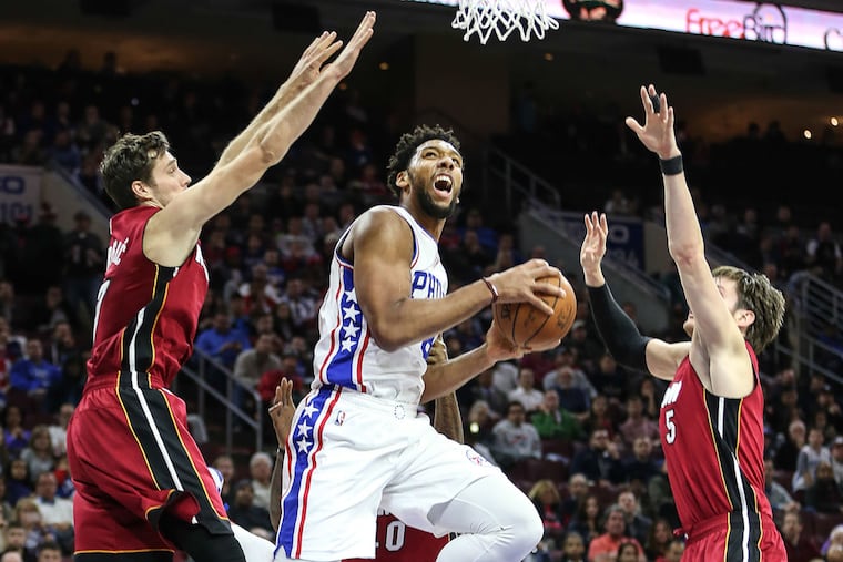 Philadelphia 76ers'; Jahlil Okafor goes up between the Miami Heat's Goran Dragic and Luke Babbitt during the second quarter on Monday, Nov. 21, 2016 at the Wells Fargo Center in Philadelphia.