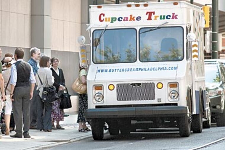 Kate Carrara's cupcake truck in happier times. "L&I confiscated the truck due to map disputes," Carrara wrote Tuesday on Twitter, to the dismay of her legion of fans. (Ed Hille / Staff Photographer)