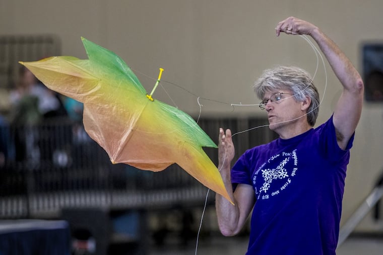 Rich Cairncross, a Drexel University professor from Media, performs in the single line indoor kite competition at the Wildwood Convention Center. He designed and built his leaf-shaped kite. This is the first year he competed.
