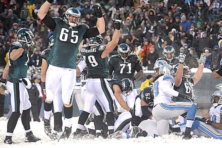Eagles players celebrate a touchdown by Nick Foles during the second half. (Michael Perez/AP)