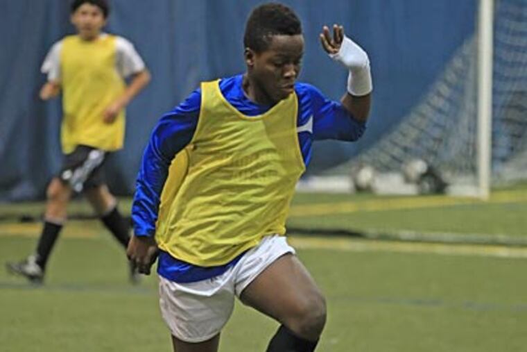Sallen Woewiyu Jr. runs a drill at The Starfinder Foundation. (Michael Bryant/Staff Photographer)