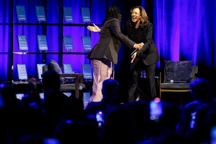 Former Vice President Kamala Harris hugs Dawn Staley, left, while promoting her new book “107 Days” at the Met on Thursday, Sept. 25, 2025 in Philadelphia.
