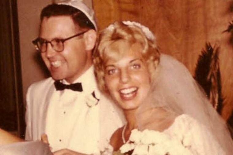 Sally Friedman and her husband, Vic, in the receiving line of their wedding in 1960.