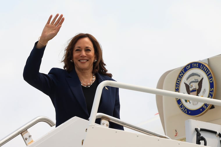 Vice President Kamala Harris waves as she boards Air Force Two following a campaign event, in Milwaukee, Wis., Tuesday.