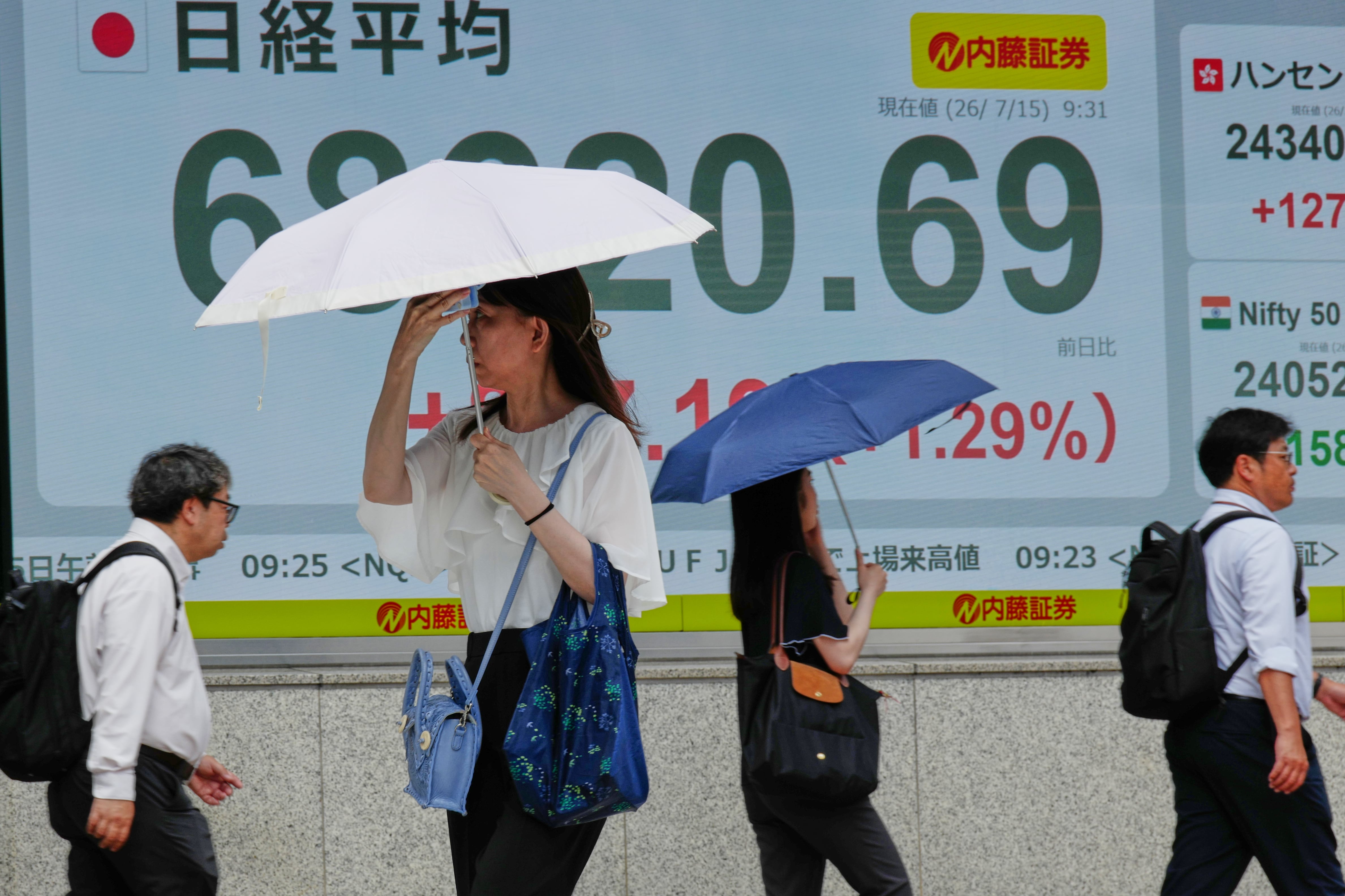 Asian shares sink, with Tokyo down nearly 5% as slumping AI stocks drag world markets lower