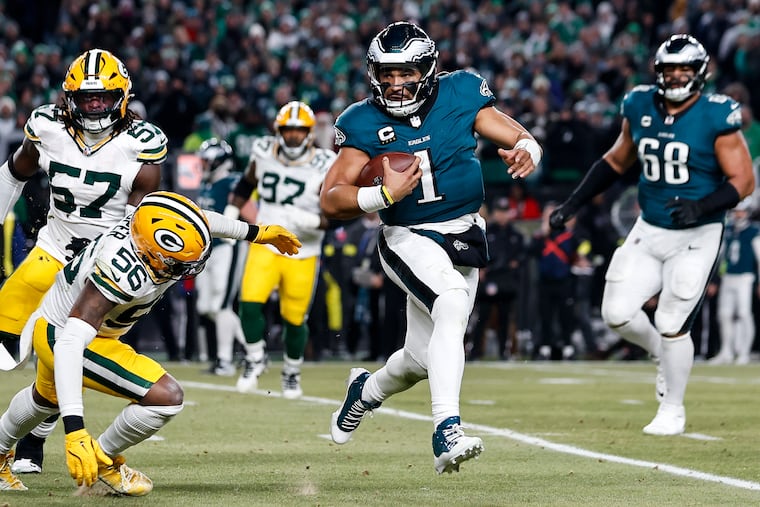 Jalen Hurts carries during the fourth quarter of the wild-card game against the Packers on Jan. 12.