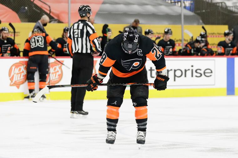 Flyers center Claude Giroux skates with his head down after the Devils' Jesper Bratt opened the scoring with a bad goal given up by Brian Elliott.