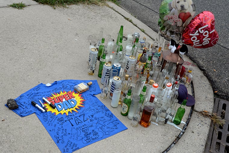 On a Camden street corner, a memorial to Oscar Camacho Jr. has sprung up. Camacho, a father of three, was fatally shot by police July 3. Authorities said Camacho aimed a weapon at them and was suicidal. TOM GRALISH / Staff Photographer