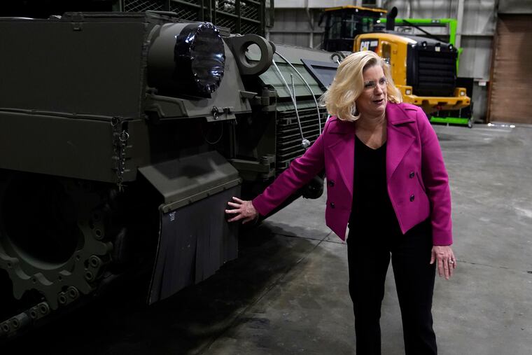 Secretary of the Army Christine Wormuth looks over the latest version of the M1A2 Abrams main battle tank as she tours the Joint Systems Manufacturing Center in Lima, Ohio.