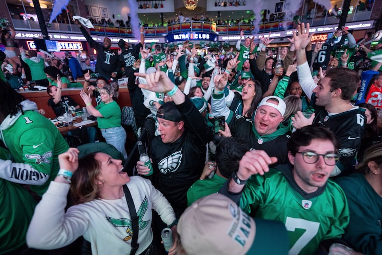 Philadelphia Eagles fans react to the Eagles first touchdown at the watch party for NFL football's Super Bowl 59 game against the Kansas City Chiefs, Sunday, Feb. 9, 2025, at Xfinity Live! Philadelphia. in Philadelphia. (AP Photo/Chris Szagola)