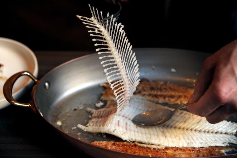 Chef/owner Greg Vernick debones the Dover sole as he filets it on a cart tableside in the dining room at Vernick Fish, on the ground floor of the new Comcast Technology Center October 24, 2019.