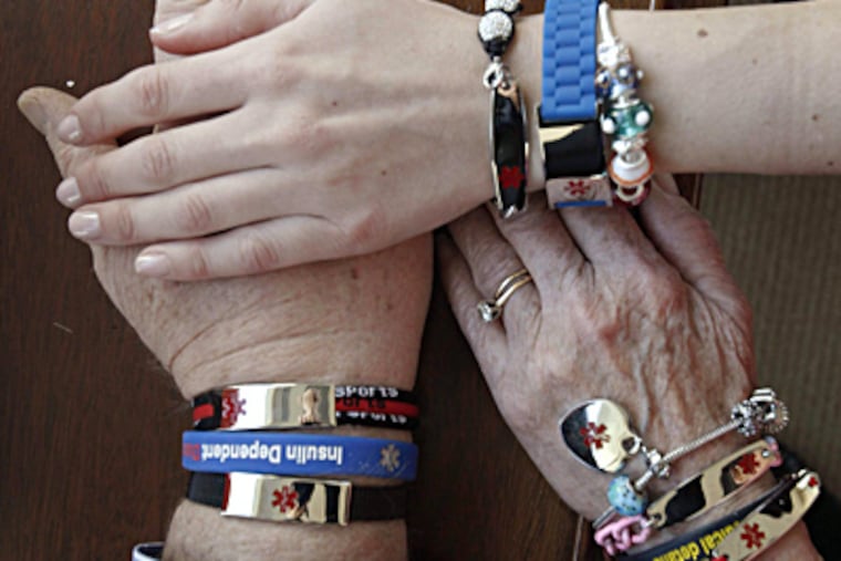 Hope Paige Designs L.L.C. employees model some of the medical-emergency bracelets the West Conshohocken company sells. MICHAEL S. WIRTZ / Staff Photographer