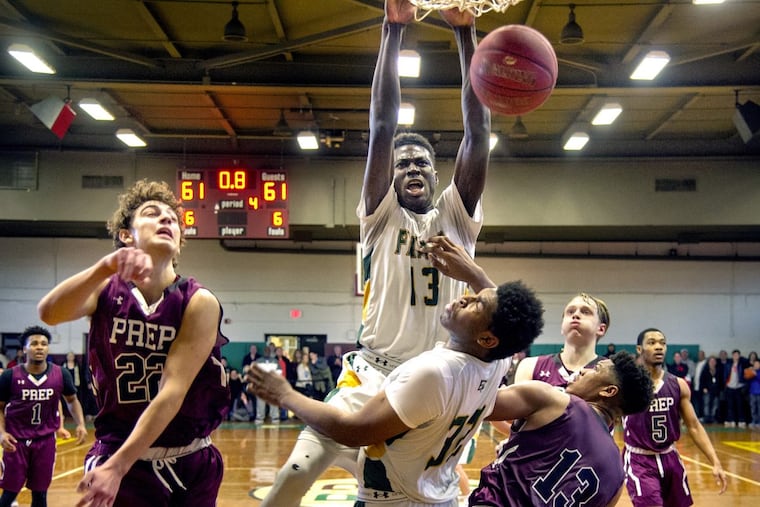 Bonner-Prendergast’s Ajiri Johnson scoring the winning basket against St. Joseph’s Prep on a dunk as time expires.