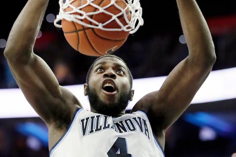 Villanova #4 Eric Paschall stuffs the ball in the 2nd half putting Nova ahead 41-36 during the Georgetown vs. Villanova University NCAA mens basketball game at Wells Fargo Center in Phila., Pa.on February 3, 2019.