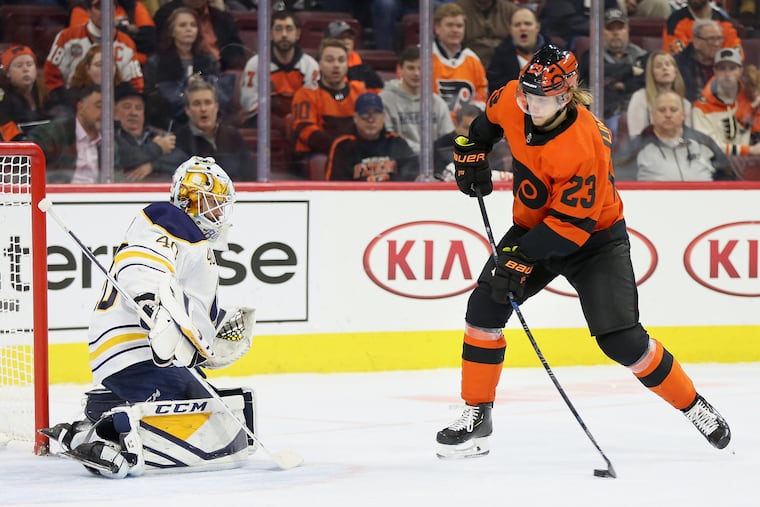 Oskar Lindblom shoots against Sabres goalie Carter Hutton.