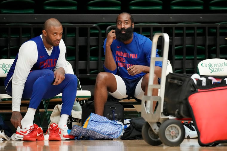 Sixers forward P.J. Tucker (left) talks with guard James Harden during practice on Thursday in Fort Collins, Colo. While Harden may have beef with president of operations Daryl Morey, that doesn't extend to his teammates like Tucker.