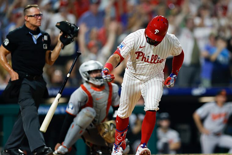 Phillies DH Kyle Schwarber drops his bat after hitting a sixth-inning grand slam, his second of the game and 40th of the season.