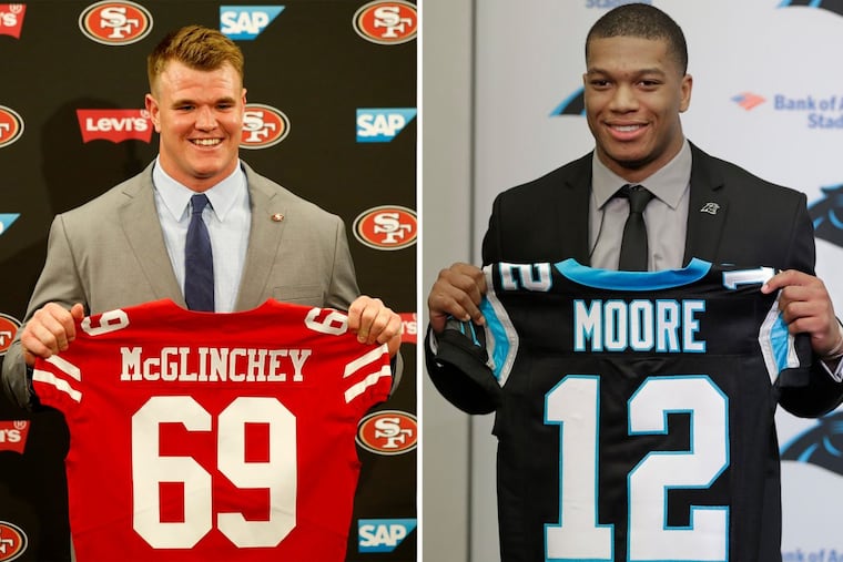 Mike McGlinchey (left) and D.J. Moore are both local products that heard their names called in the first round of the NFL draft on Thursday.