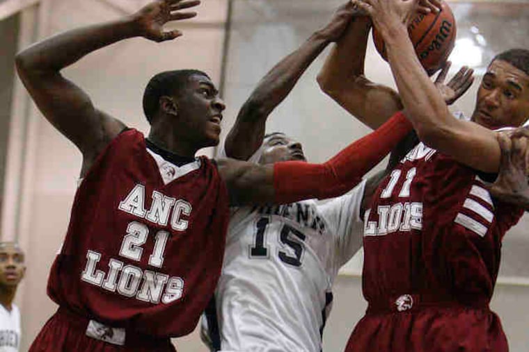 Friends' Central's Devin Coleman is sandwiched between ANC's Savon Lloyd-Goodman (left) and Malcolm Gilbert.