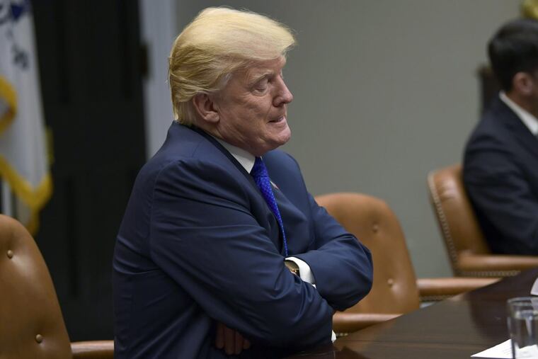 President Donald Trump pauses as he is asked a question by a reporter as they are leaving the Roosevelt Room of the White House in Washington, Tuesday, Nov. 28, 2017, during a meeting with Republican congressional leaders. (AP Photo/Susan Walsh)