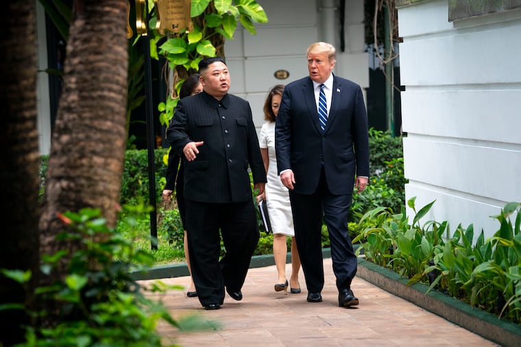 President Donald Trump (right) walks with Kim Jong Un, the North Korean leader, as they head to a meeting in Hanoi, Vietnam, Feb. 28, 2019. Trump wants to curtail military exercises with South Korea, saying they were hostile to North Korea. But under Kim, the North has become increasingly belligerent toward the South.