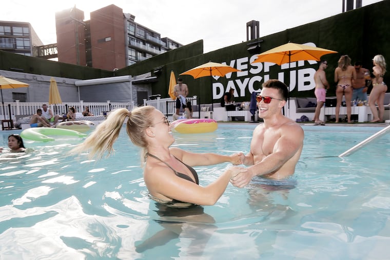 Jillian Darrah and Kahn Wiedis of Philadelphia enjoy the pool at the Vesper Day Club.