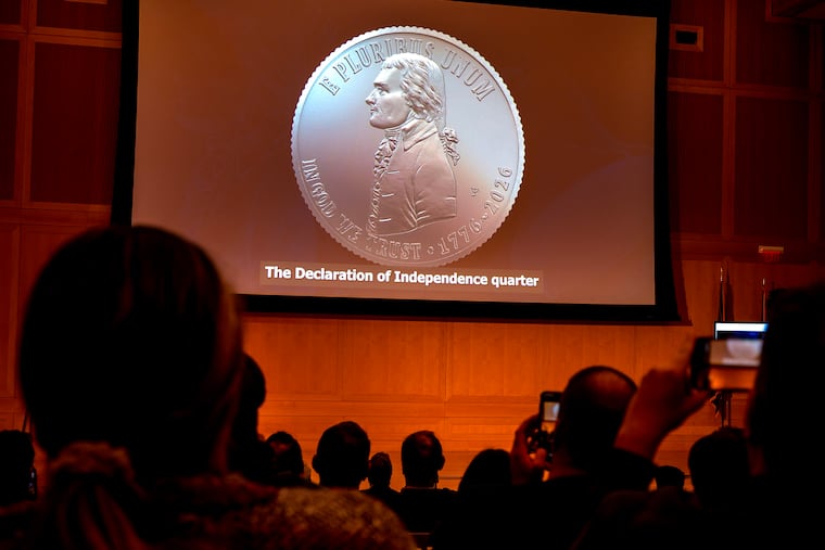 The obverse of the Declaration of Independence quarter is shown on screen as the U.S. Mint unveils new coins for the Semiquincentennial at the National Constitution Center in Philadelphia Wednesday night. The new dimes, quarters, and half-dollars feature three Philly landmarks.