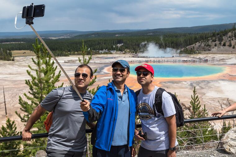 A safe way to take a selfie -- staying on the trail and behind the barrier -- at Yellowstone National Park on the Grand Prismatic Spring Overlook Trail.