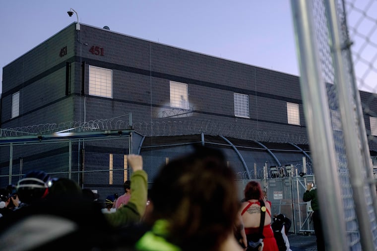 A detained person is by a window inside the Delaney Hall ICE facility, as people protest outside, in Newark, N.J., on June 5, 2026. People held inside the immigration detention center have complained for months about dirty, unhealthy living conditions.